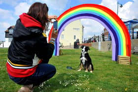 Posing beneath the giant knitted rainbow on Coronation Green in Shoreham. Picture: Steve Robards SR2105033