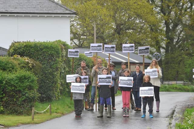 East Chiltington villagers with the new signs. Photo by Charlotte Boulton