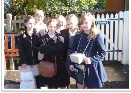 Castlewood Primary School children looking suitably glum as they prepare to be evacuated to Horsted Keynes station in 2017 SUS-210517-140450001