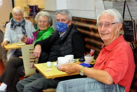 People enjoying a bite to eat at Lynne's Cafe in Church Walk. Pic S Robards SR2105171 SUS-210517-165123001