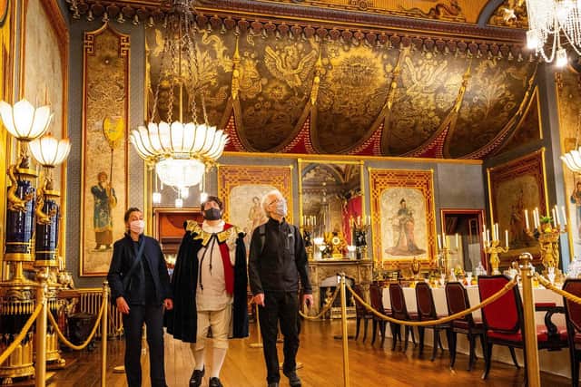 The first visitors to the pavilion on Monday, Anne and James Berry with 'King George IV' in the banqueting hall