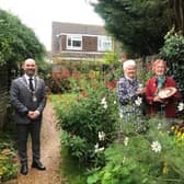 Valerie Narayanaswamy and Jacqueline Patrick with Rustington Parish Council chairman Jon Street at The Hidden Twitten, last year's winner of best community garden