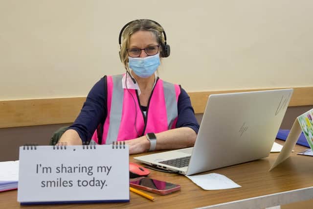 A team member at the vaccination clinic in Meridian Hall, East Grinstead.