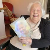 Peggy Johnson from Horsham with her 105th birthday card from the Queen SUS-210518-110310001