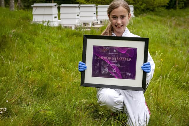 Poppy Liddle is the first junior beekeeper for Rolls-Royce SUS-210518-124943001