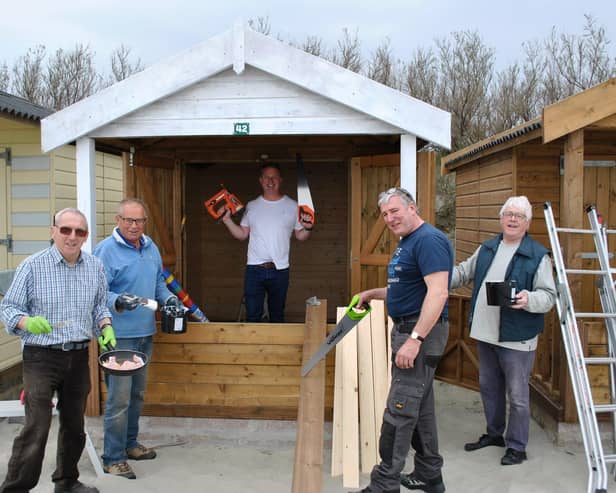 Chichester Rotarians Ray Richardson, Peter Haydn Jones, Tim Reedman, Neil Hughes and Trevor Ware, kitting out Chichester Boys Club’s new beach hut at West Wittering beach
