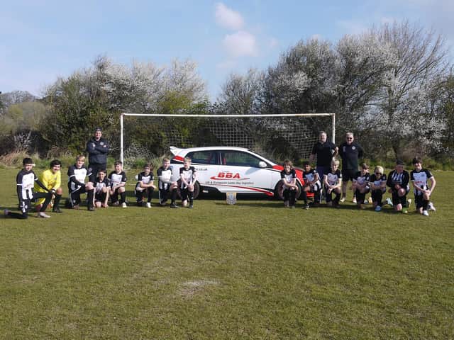 Rustington Otters under-13s with their new sponsors