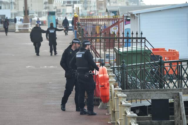 Police were seen on the seafront after the bags were spotted in the sea SUS-210524-122155001