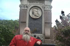 Cllr Paul Plim at the Lane memorial in the town square. Lt Col Henry Lane was the first Chair of Bexhill Local Board, the first Chair of Bexhill Urban District Council, and was known as the father of Bexhill local government. SUS-210525-152351001