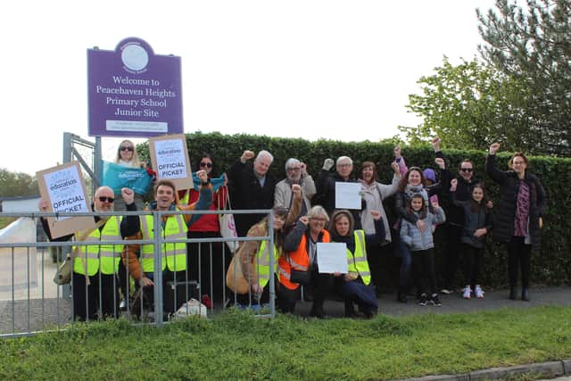 Union members and campaigners outside the school today
