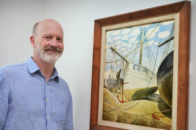 Art historian and curator James Russell with Mackerel Sky by Eric Ravilious. Photograph: Justin Lycett/ hn14902 (1)