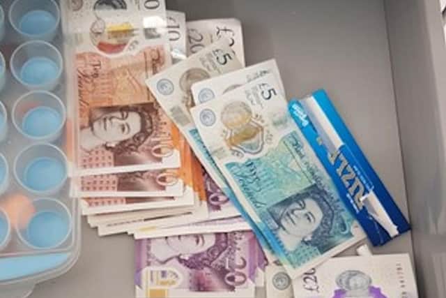 This shows cash seized when officers raided an address in Terminus Road, Brighton. Photo from Sussex Police. SUS-210527-121927001