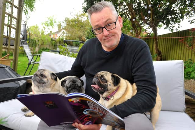Tim Southwell with his pugs and his new comic Pugs In Space. Picture: Steve Robards, SR2105272
