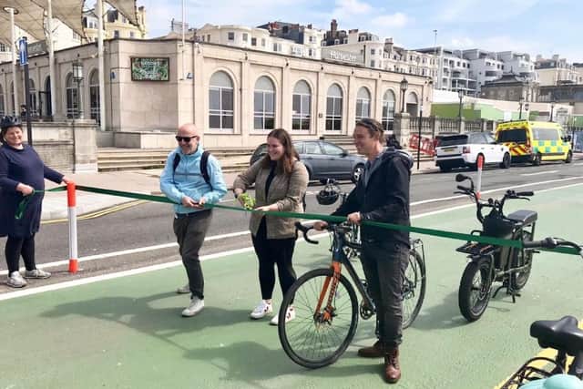Cutting the ribbon at the new cycle lane. Picture: (from left to right) Cllr Steve Davis, member of the Environment, Transport and Sustainability (ETS) committee, Amy Heley, Chair of the ETS committee and Jamie Lloyd, Deputy Chair of the ETS committee