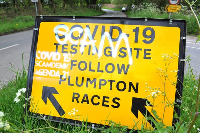 Graffiti on a yellow directions sign on North Common Road at the junction of Plumpton Road, near Plumpton and Wivelsfield Green. Picture: Steve Robards, SR2105273