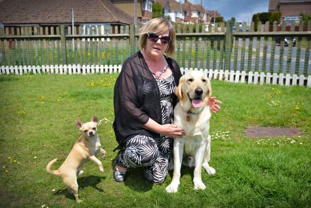 Dawn Penney with her guide dog Mr Miller in Sidley, Bexhill.
Also pictured is Louie. SUS-210531-070224001