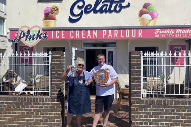 Katy Alston with her son Henri and their awards for Pinks Parlour