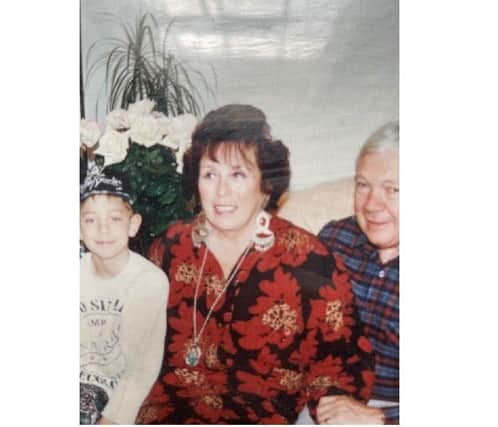 Jane Amstad pictured with her husband Nicki and one of her grandchildren Michael SUS-210206-182136001