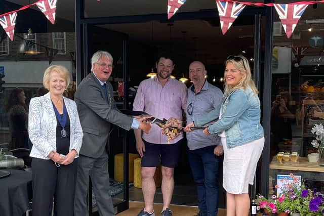 Howard Mundin and Mims Davies cut the ribbon at Hart Country Stores. Picture: Haywards Heath Town Council SUS-210706-164612001