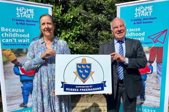 Alyson Smith (left), the business and fundraising manager from Home-StartCHAMS and Christopher Moore, head of Sussex Freemasons
