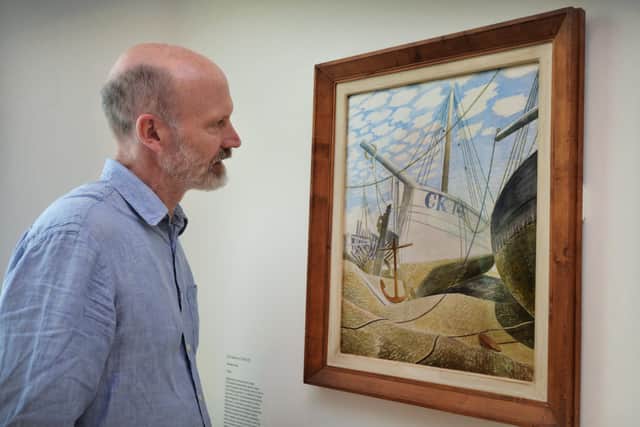 Guest curator of Seaside Modern at Hastings Contemporary James Russell with Eric Ravilious's watercolour Mackerel Sky. Photograph: Justin Lycett/ hn14902 (3)
