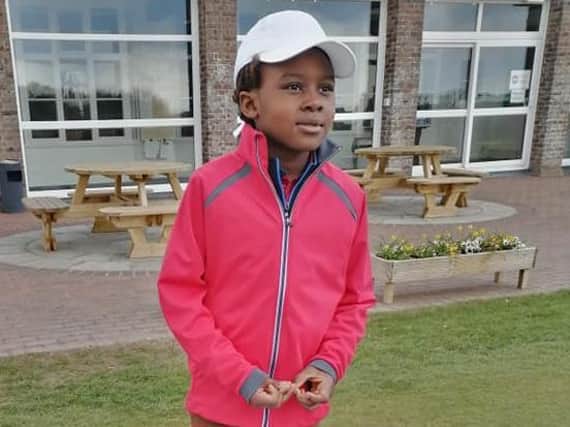Michael Egan, seven, is shining on the golf course
