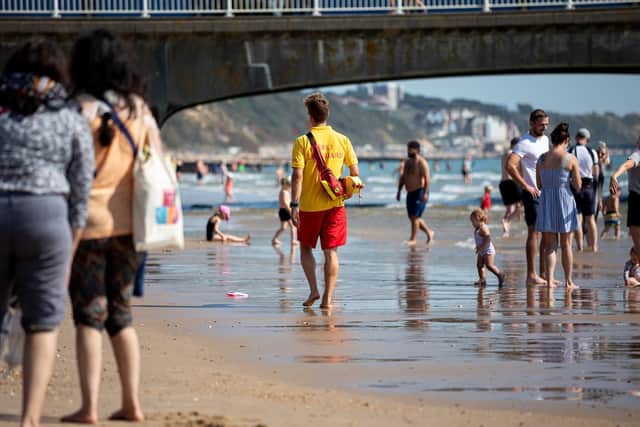 Smartphones can help people plan their day at the coast and check things like the weather, tide times and where our lifeguards are patrolling. Photo: RNLI