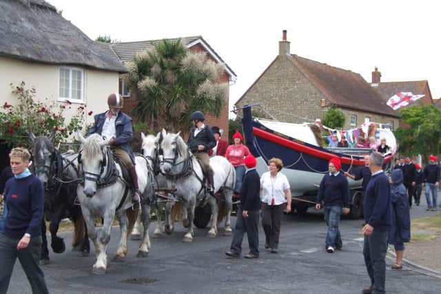 The Queen Victoria lifeboat being pulled through the streets of Selsey in 2011 in celebration of the station’s 150 anniversary. picture: RNLI / Roger Browell