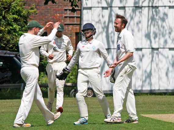 Lindfield CC celebrate the wicket of Wajid Shah in their derby victory over Burgess Hill CC. Pictures by Derek Martin