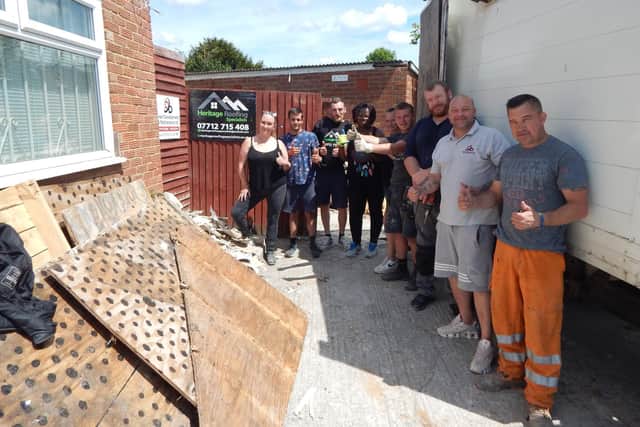 Joe Dines (left) with many of the ‘family’ helping to get the Giving Back Crawley premises ready. Picture by Mark Dunford