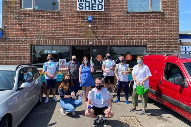 Co-Op staff outside the Men's Shed