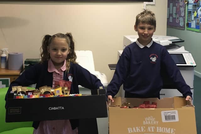 Stanley and Elsie raised enough money to purchase a defibrillator for their school