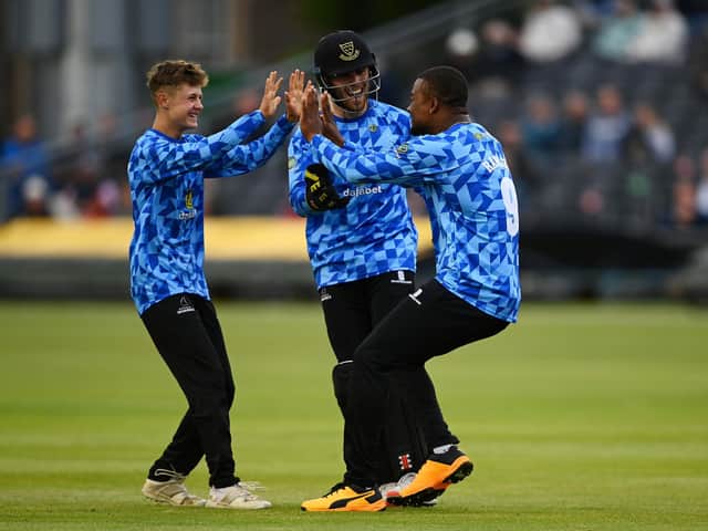 Archie Lenham, left, celebrates his wicket as he becomes English T20's second youngest player / Picture: Getty
