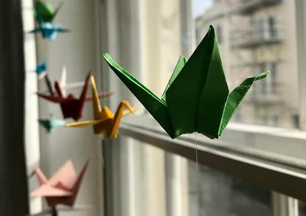 The memorial will involve thousands of paper cranes