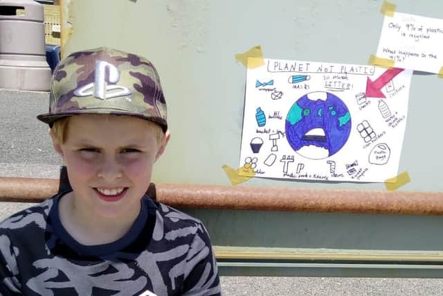 Jamie Hewitt, aged 9, from Horsham, put up a poster in Shoreham to encourage people not to litter SUS-210614-150327001