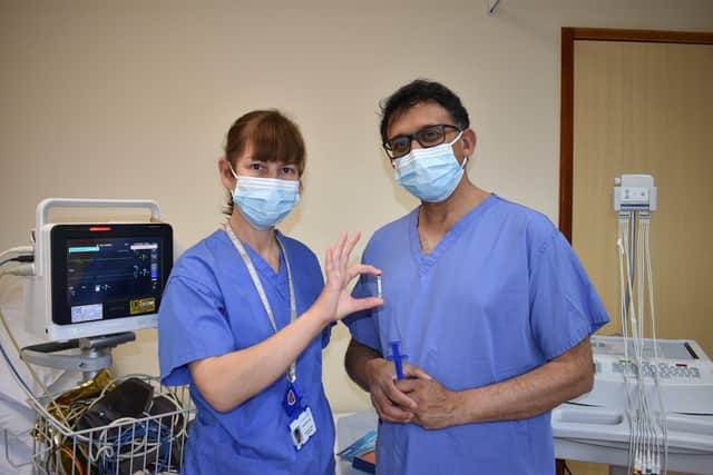 L-R Jacqui Hunt, heart failure and devices specialist nurse, with monitor implant and professor Nikhil Patel, consultant cardiologist. SUS-210614-115753001