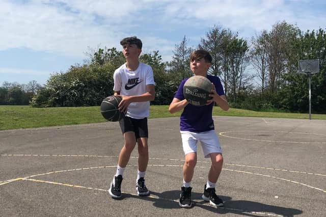 Felpham Community College students Max Chester and Rylee Newman completed an eight-hour sponsored basketball shoot to raise £500 for charity