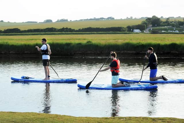 Paddle Boarding at Cuckmere Haven (Photo by Jon Rigby) SUS-210616-083632001