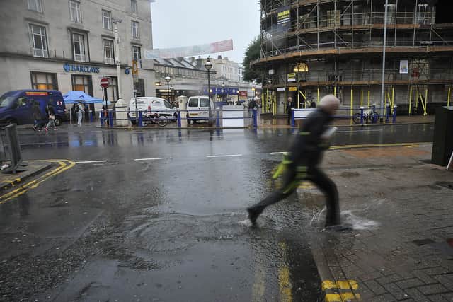 Rain in Eastbourne town centre. SUS-150813-125344001