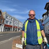 Andy Newton-Prince volunteers to pick up litter throughout the community