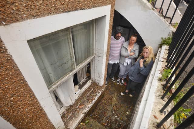 Basement area of a property in South Terrace, Hastings, flooded during a storm on 16/6/21.

Property owner Sarah Lake, centre, with tenants David Lee and Flora Storm. SUS-210617-135751001