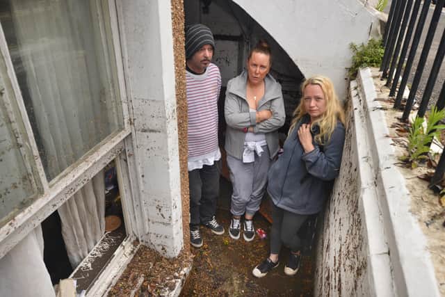 Basement area of a property in South Terrace, Hastings, flooded during a storm on 16/6/21.

Property owner Sarah Lake, centre, with tenants David Lee and Flora Storm. SUS-210617-135949001