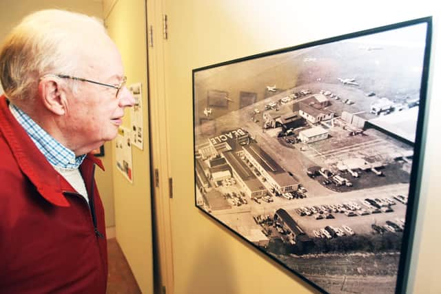 Derick Poulter studying one of the photos in the exhibition at Marlipins Museum in Shoreham in October 2016. Picture: Derek Martin DM16145408a
