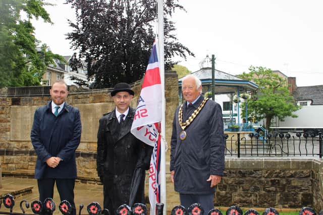 Councillor Billy Greening, the Royal British Legion's Zal Rustom and council chairman councillor David Skipp at the flag raising