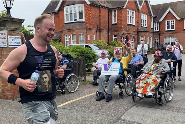 Dan Skipp passes the Care for Veterans hospital home in Worthing on his ultra-marathon