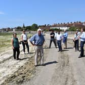 John Nelson, Chair of the Chichester Harbour Trust (front centre) and Jonson Cox, Chair of Ofwat (front right) host representatives from the key environmental agencies in Bosham (Credit: Keith Sinclair) SUS-210622-090715001