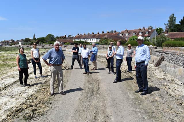 John Nelson, Chair of the Chichester Harbour Trust (front centre) and Jonson Cox, Chair of Ofwat (front right) host representatives from the key environmental agencies in Bosham (Credit: Keith Sinclair) SUS-210622-090715001