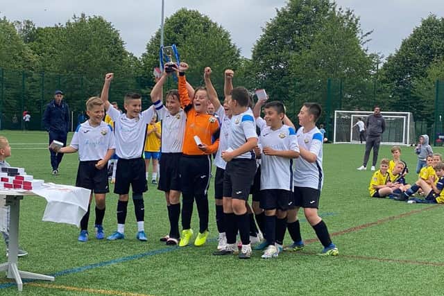 Pagham under-12s lift the cup