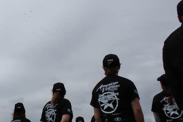 American Veterans Archaeological Recovery team members honouring the three airman with a memorial service and Spitfire flypast