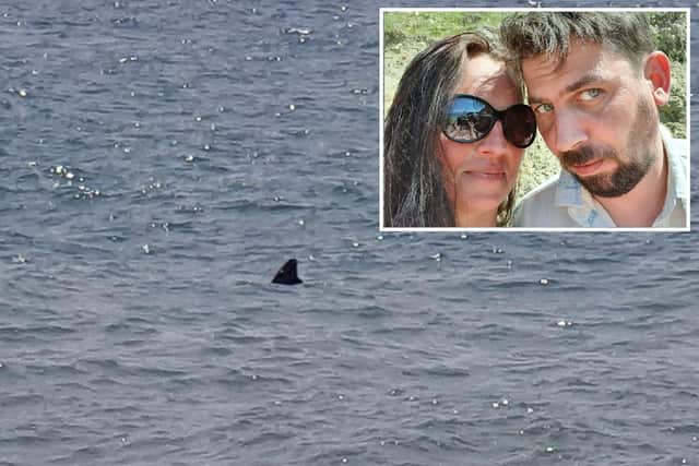 Tatjana and Andrew said they spotted what they believed to be a shark on Tuesday morning SUS-210625-121147001